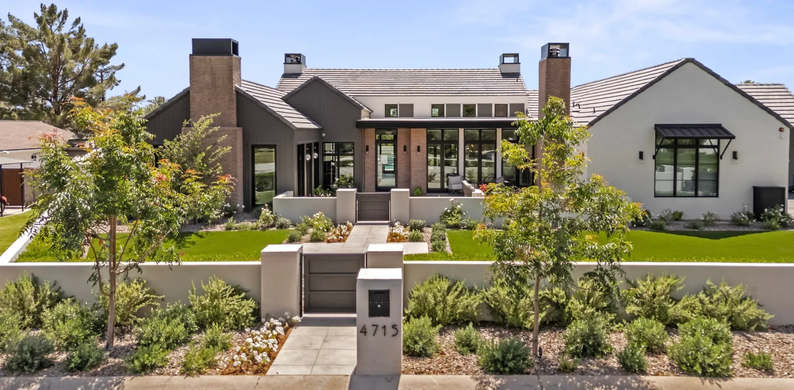 Modern luxury residence with landscaped front courtyard