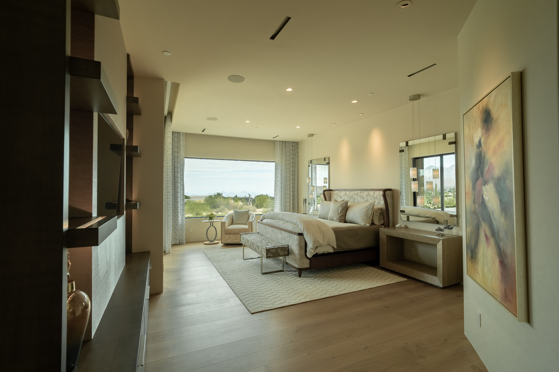 Primary bedroom with a large picture window overlooking the desert